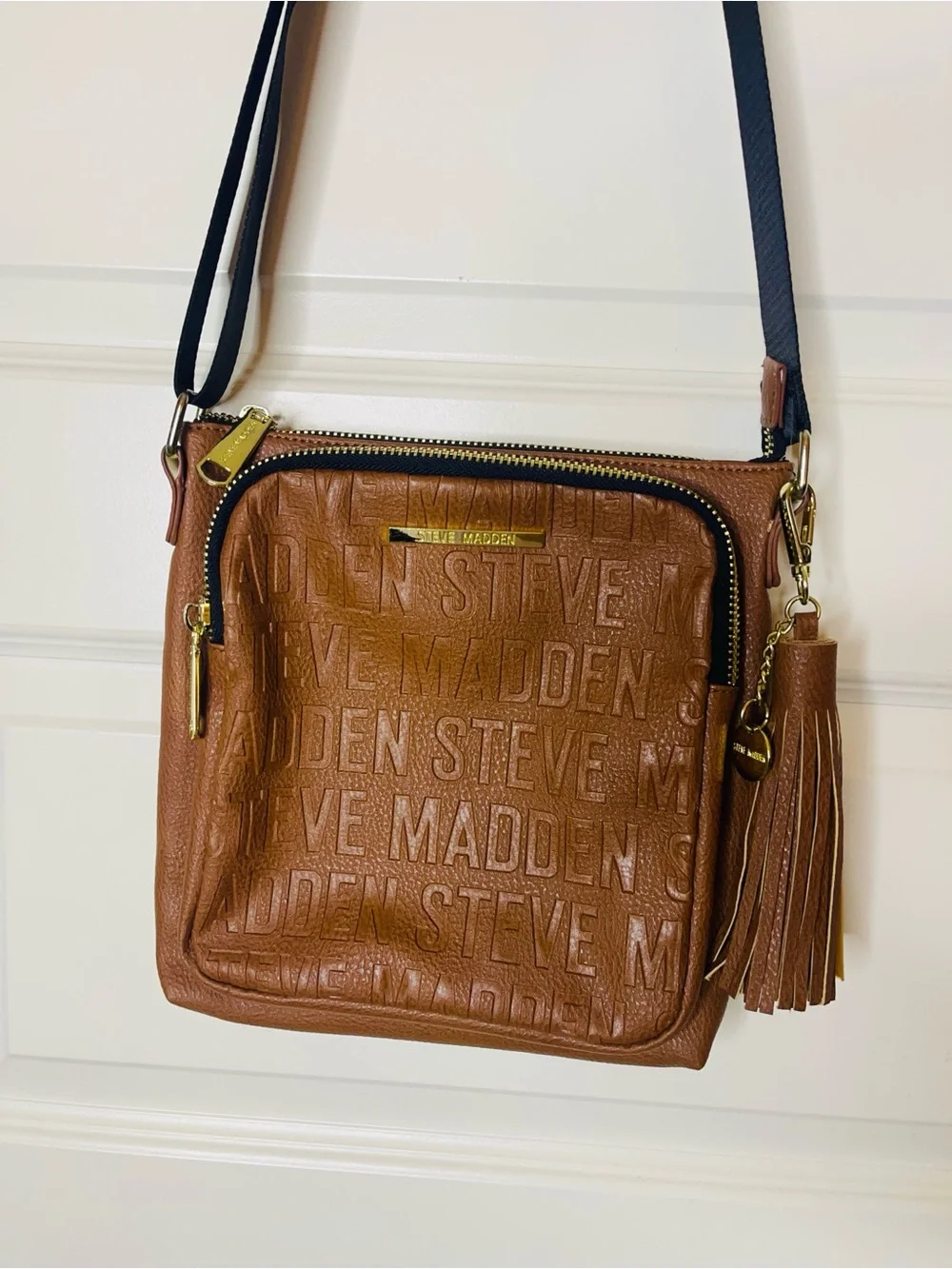 Steve Madden | BGLAMM Camel Logo  Embossed Crossbody with Tassel